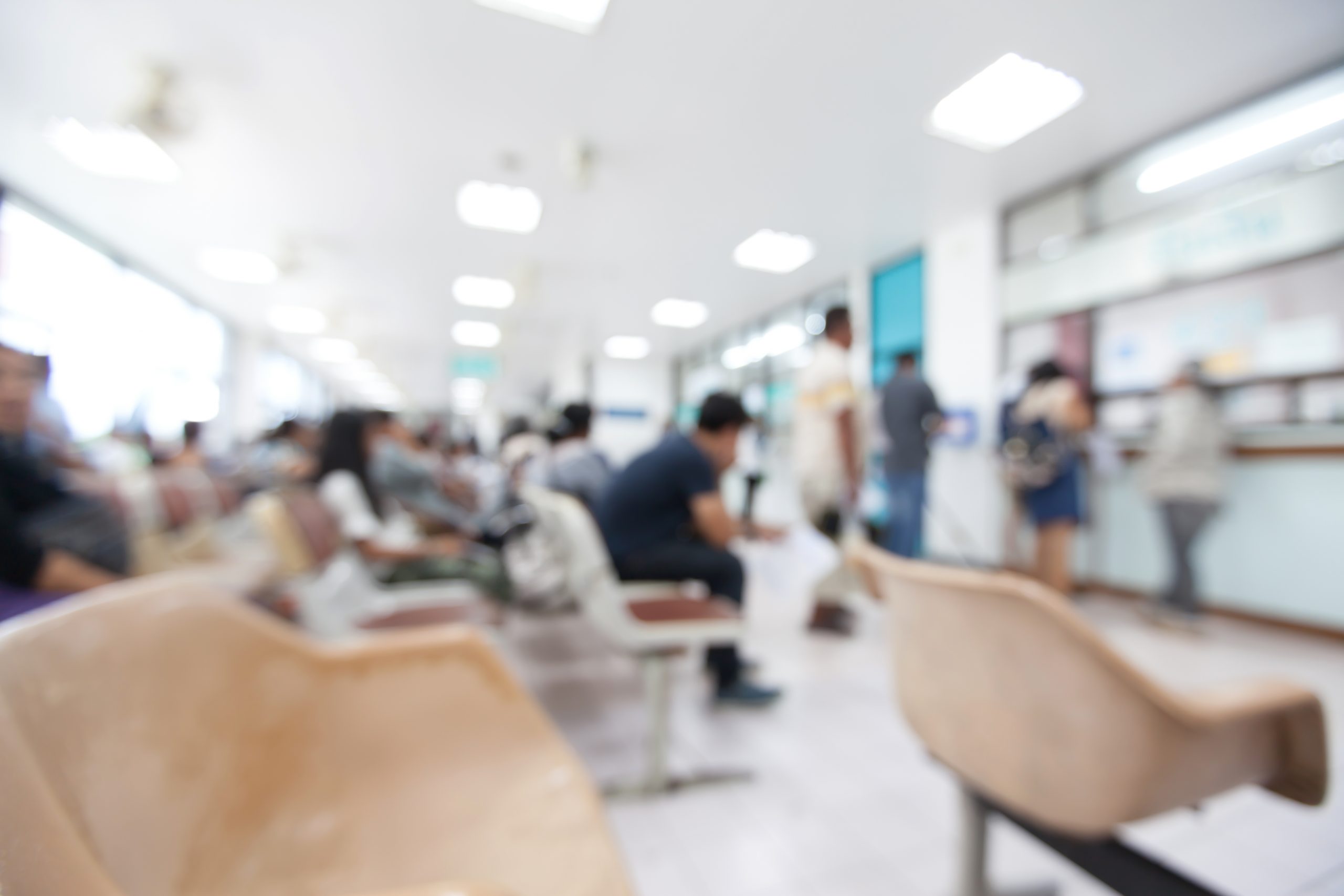 A busy waiting room in a GP surgery.